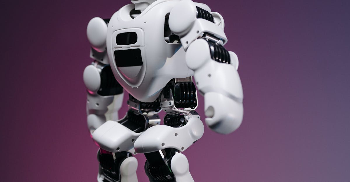 A futuristic white humanoid robot standing on a reflective surface against a gradient background.